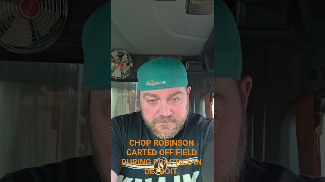 Chop Robinson carted off the field during practice with the Lions.