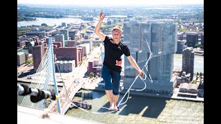 Slackliner Jaan Roose completes 625m river crossing between highest buildings in Rotterdam
