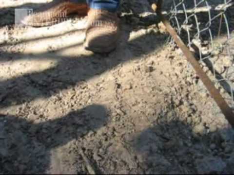 Natural gas pours from a vent at an oil well in Ha...