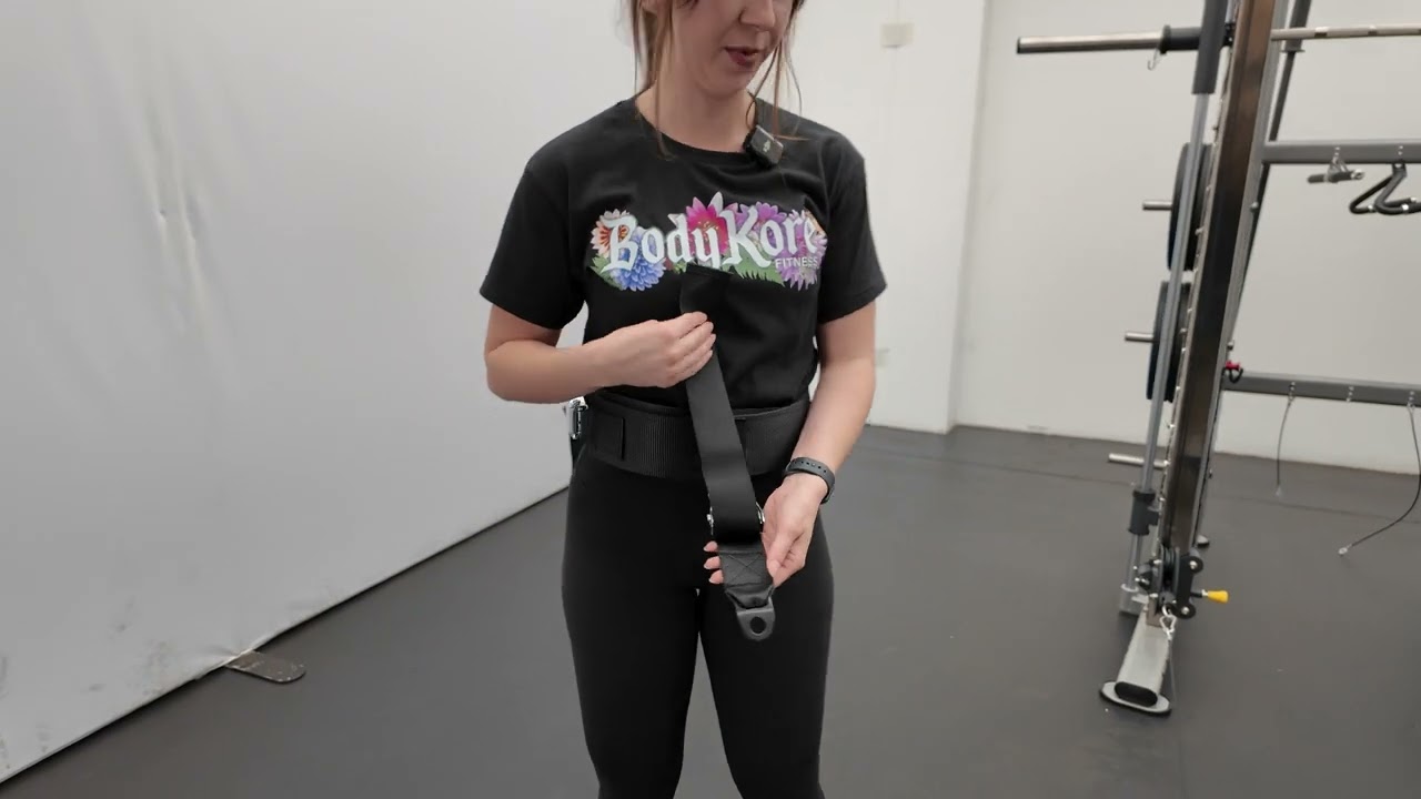 Gabi demonstrates how to use the Squat Box with a cable machine.