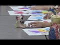 Ashwaubenon High Schoolers surprise first graders with ceramics of their artwork