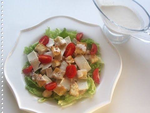 Caesar salad with chicken and croutons. Cooking is easy