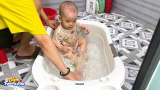 Baby Kim giggled with delight as played in the water for the first time