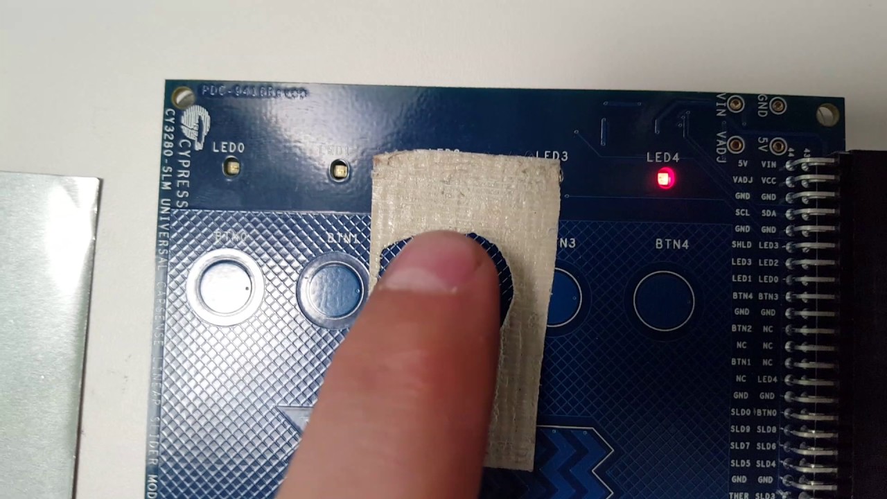 Cypress capsense through metal