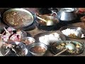 Two sisters are cooking and eating Local chicken Curry in the Village