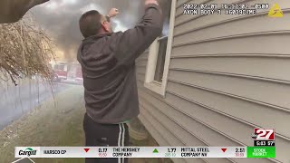 CAUGHT ON CAMERA: Officer saves boy from burning home in Warwick Twp.