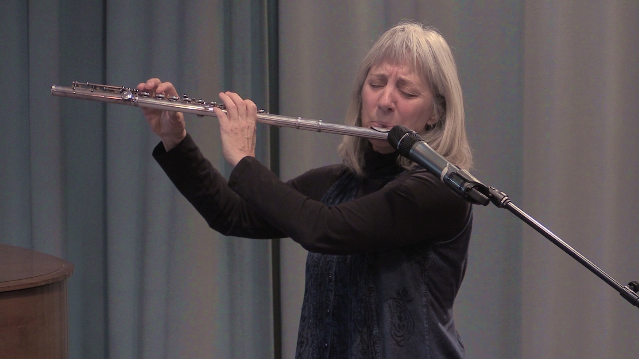 Roshana Ariel performing a Christmas carol on flute