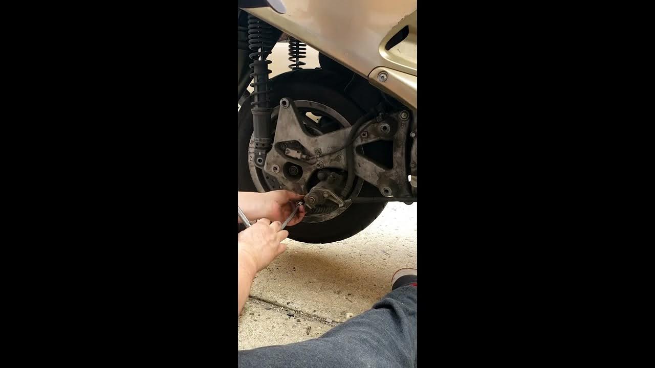 rear tire change on a Honda reflex nss250 scooter.. - YouTube