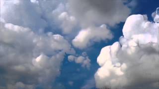 Time-lapse clouds photography. Clouds pass by at about 300x normal speed.
