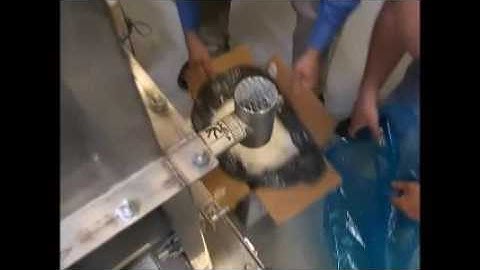 THAYER SCALE Model PFM-S Volumetric Feeder handling raw coconut