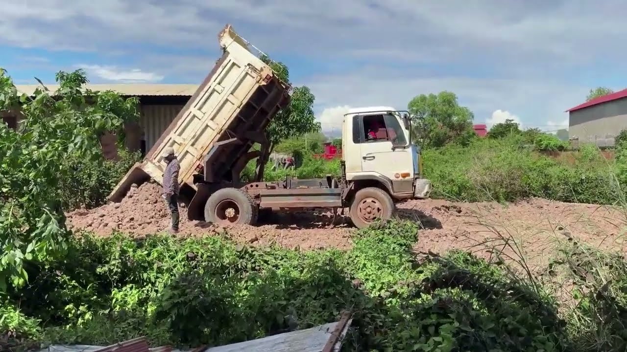 Incredible Skills Bulldozers to push the soil into the lake with trucks worked together to dump soil