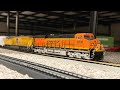 BNSF Es44ac #6308 hauls freight cars with Union Pacific es44ac #2535 Ho scale 