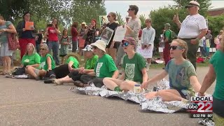 Protesters block road in front of Williston ICE office, 13 people detained