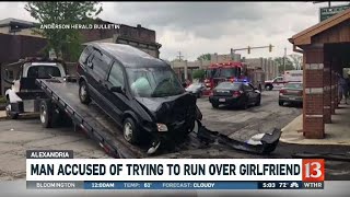 Man accused of trying to run over girlfriend