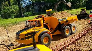 huina excavator loading rc tractors and dump trucks