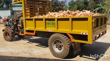 Xe công nông cầu đẩy của gara đông xuân màu vàng chở gạch rất khỏe