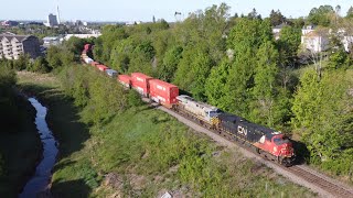 Awesome Aerial 4K View! Big Stack Train CN 120 w/Inspection Car & DPU Heading Out of Moncton, NB