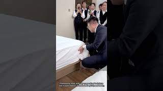 Hotel Staff Demonstrate Fast Bed-Making Skills Content