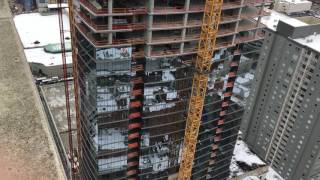 Raising the third and last tie in for tower crane