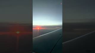 Plane window sunset