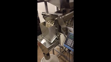 The Logical Machines Model S-4 Automatic Scale System filling 2.5lbs Bird Seed.