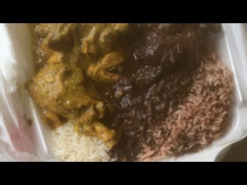 Curry chicken stew chicken rice and beans white rice Jamaican food