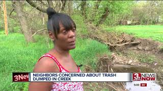 Neighbors concerned about trash dumped in creek