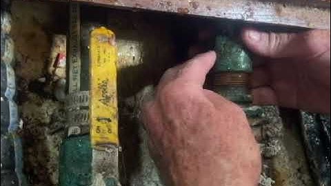 Packing a sailboat stuffing box while the boat is in the water.