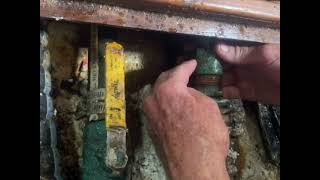 Packing a sailboat stuffing box while the boat is in the water.