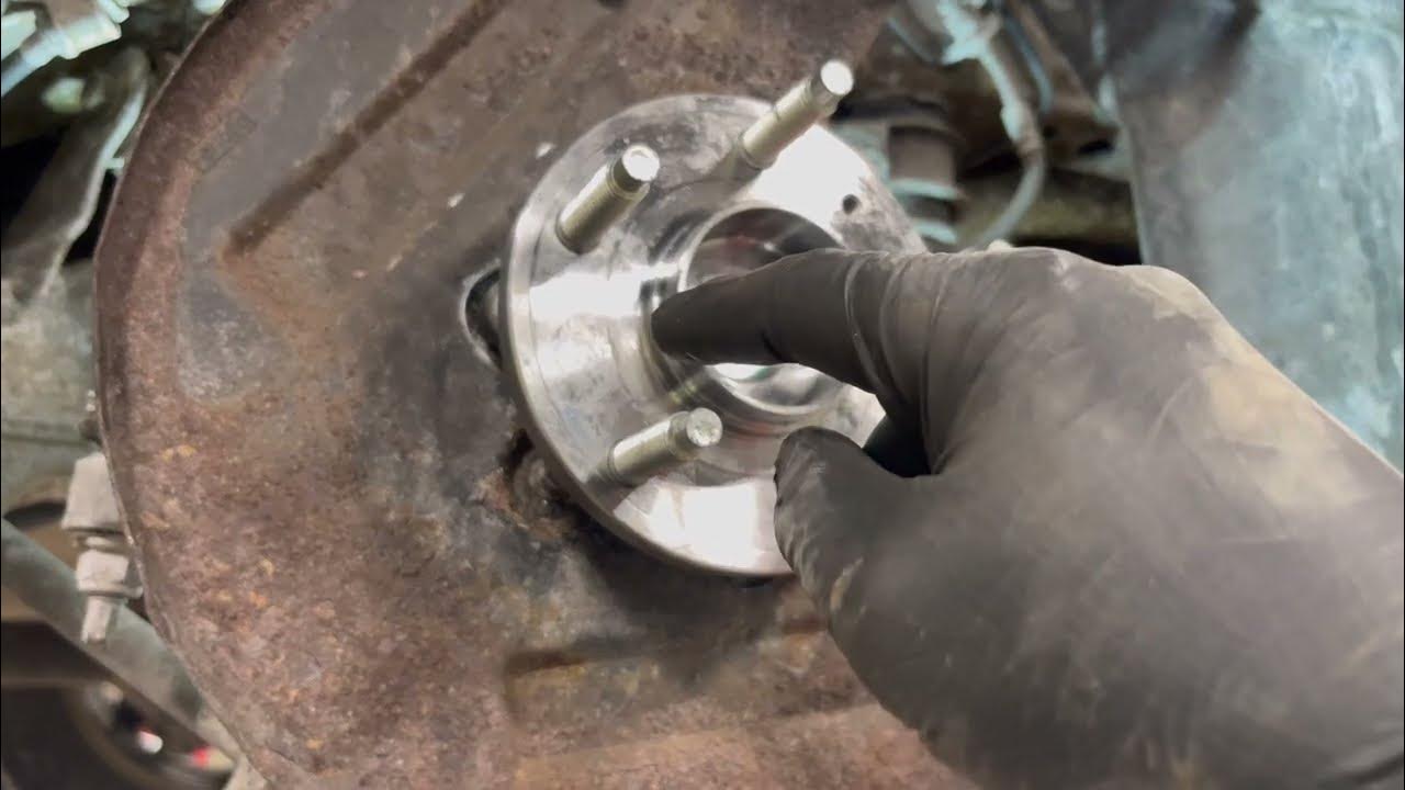 How to replace a Wheel bearing on a 2010 Ford Taurus. - YouTube