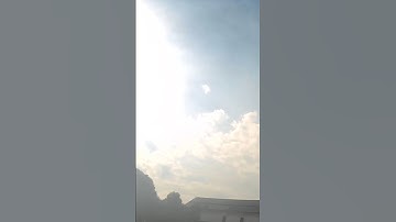 Darkening sky: clouds swirl and change during eclipse