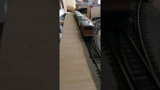 Class 47 is coming through with the goods train and the crane