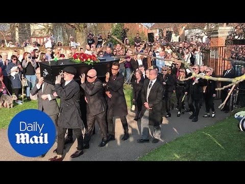 Keith Flint's coffin is carried into church by friends and fans