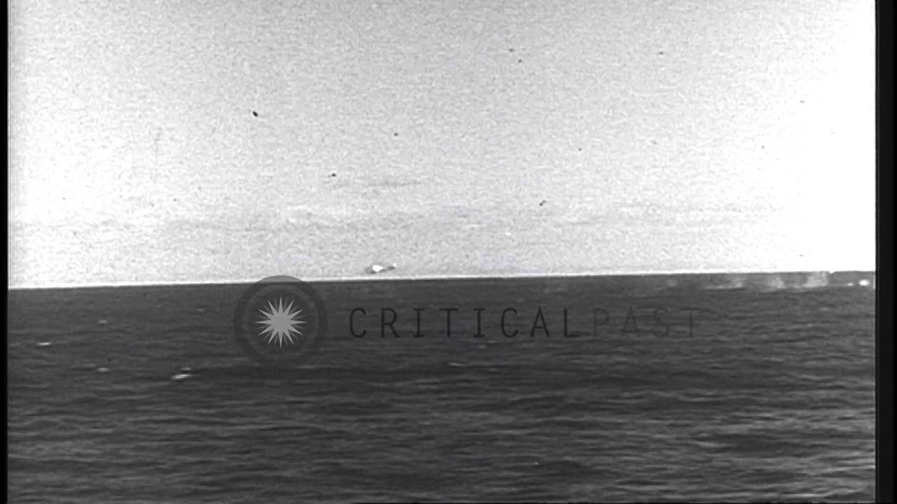 A British Pom Pom gun shoots down an enemy aircraft in the Atlantic Ocean during ...HD Stock Footage
