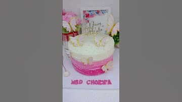 Thumbnail of kue ulang tahun putih dan pink dengan hiasan kupu-kupu #dekorasikue #kueulangtahun #kuekarakter