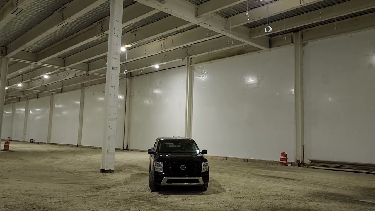 Weather Protection Shrink Wrap Walls. Temporary Walls to Heat Construction Project in Winter.