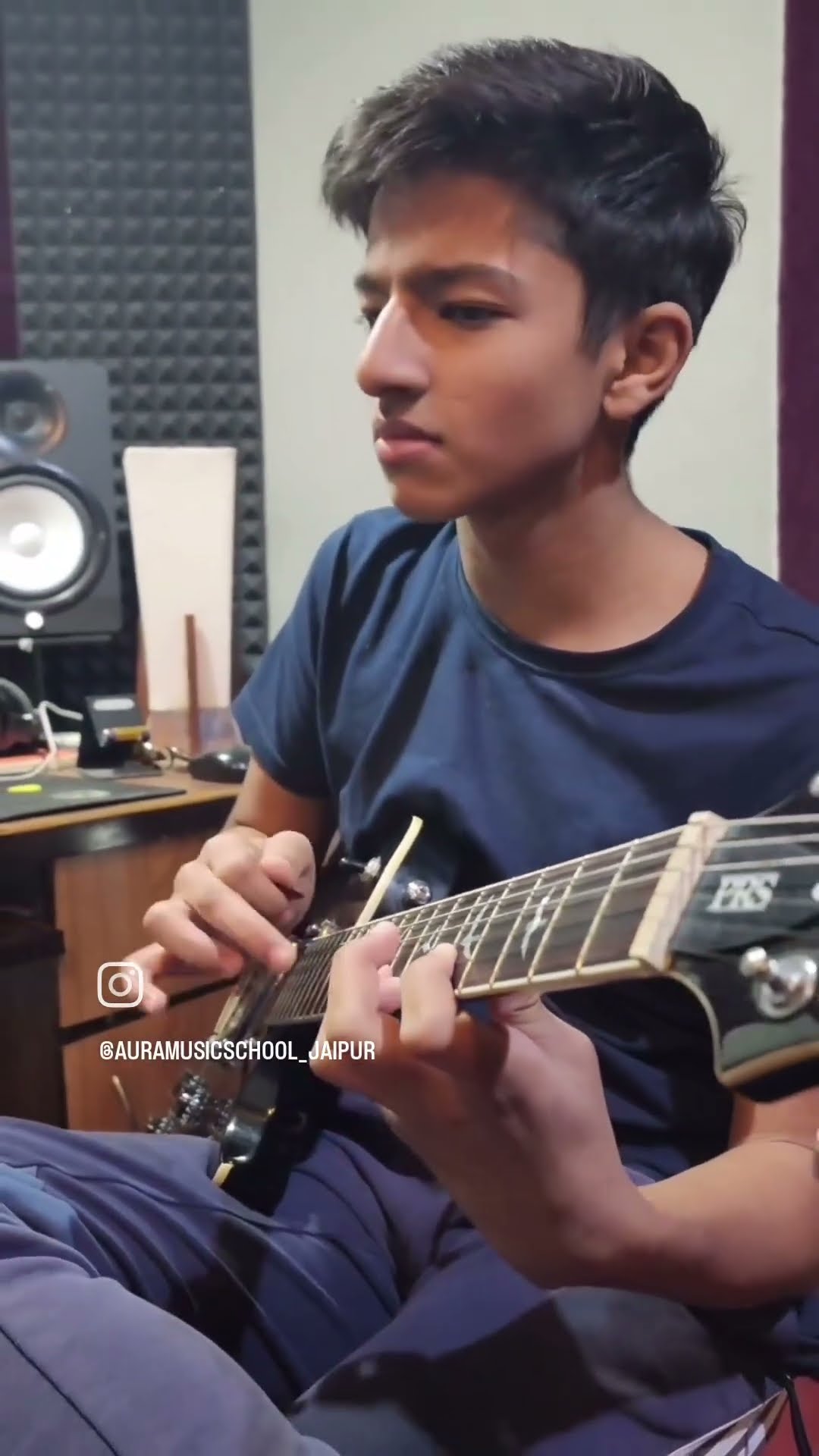 Raghhav playing his own composition on guitar