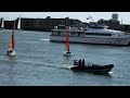 Police tow in dinghies struggling with the tidal race in Portsmouth harbour.(3)