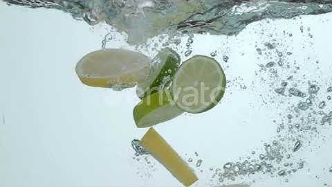 Lemon and lime slices splashing into water in slow motion; shot on Phantom Flex 4K at 1000 fps |...