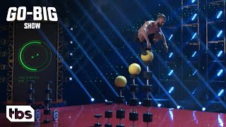 Go Big Show: Contestant Balances on 7 Feet Tall Stack of Weights (Clip) | TBS