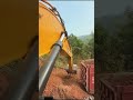 Excavators Load Soil Onto Trucks