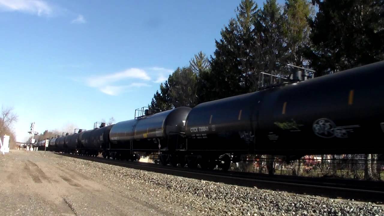 Dakota Minnesota & Eastern SD40-2 6069 leads a crude oil train through Chesterton IN