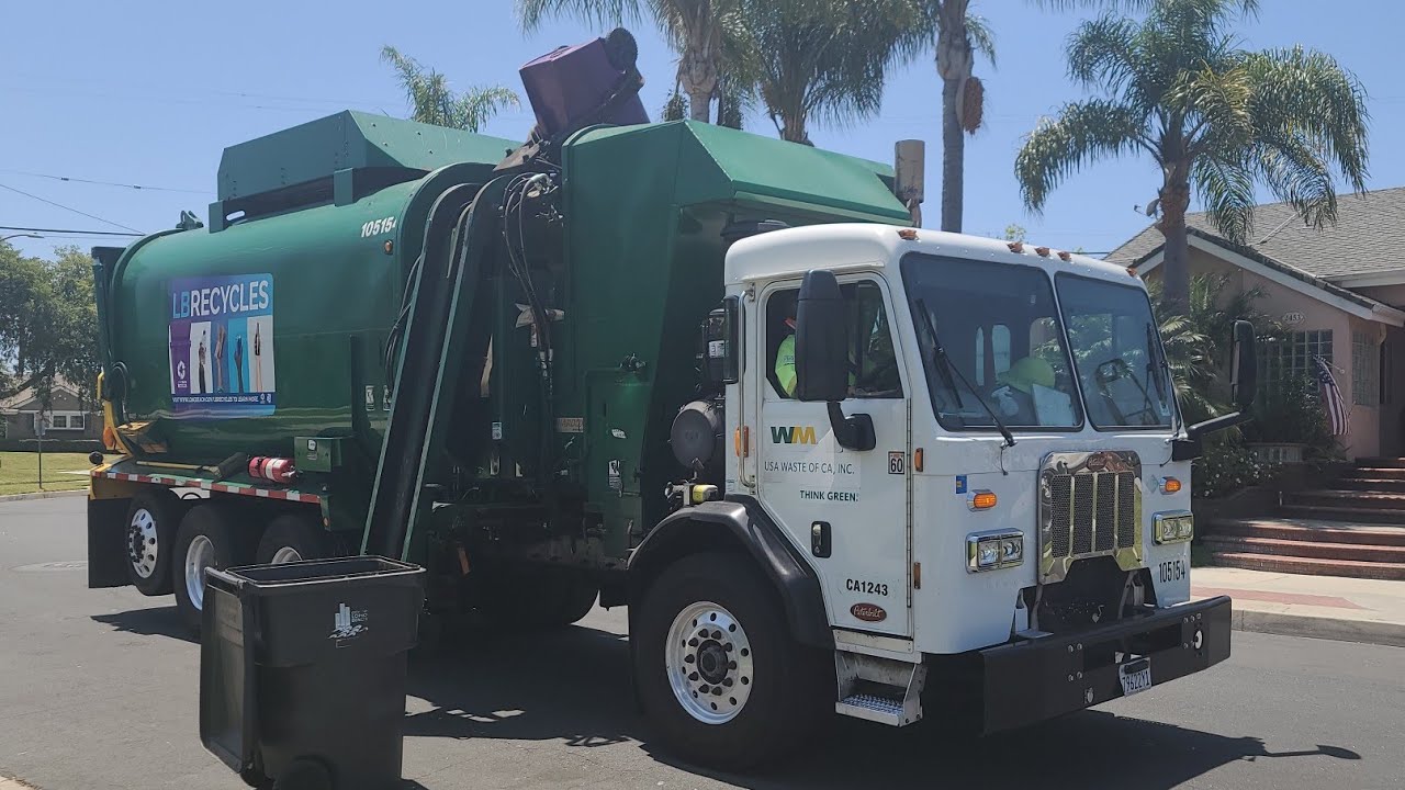waste-management-peterbilt-320-amrep-garbage-truck-collecting-long