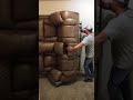 Moving an electric reclining couch into an apartment.