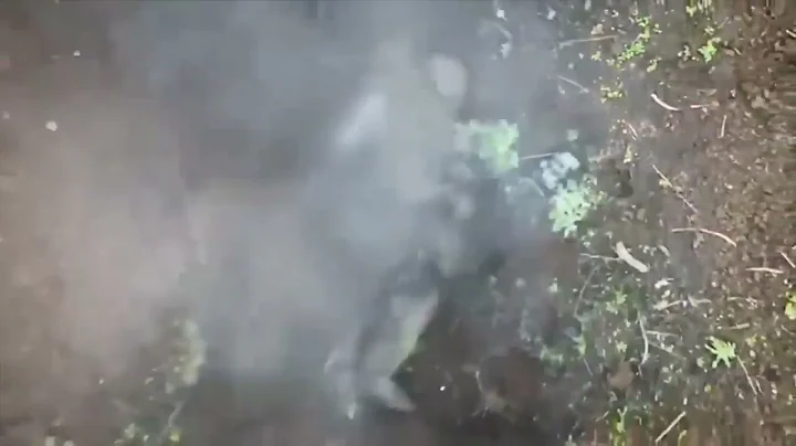 Russian soldier catches and throws bomb dropped by Ukrainian drone