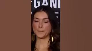 Ring girl stares at UFC Champion