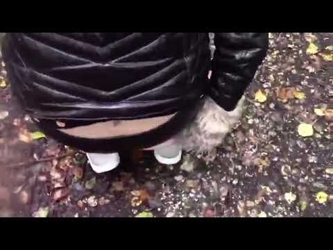 Girl farting loudly in leather pants outdoors