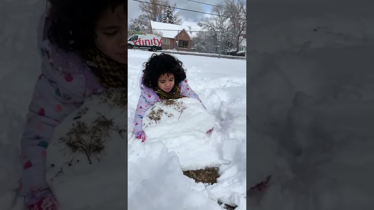 Little Girl Loses Balance And Falls While Attempting To Lift Heavy Boulder Of Snow 1179995 3