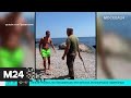 В Крыму уволили охранника санатория, нагайкой прогонявшего туристов с пляжа - Москва 24