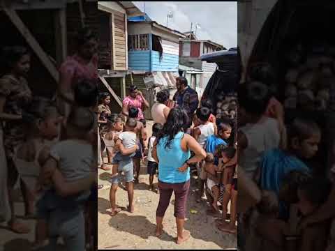 Dave Narine distributes bread and other necessities to depressed communities in Guyana